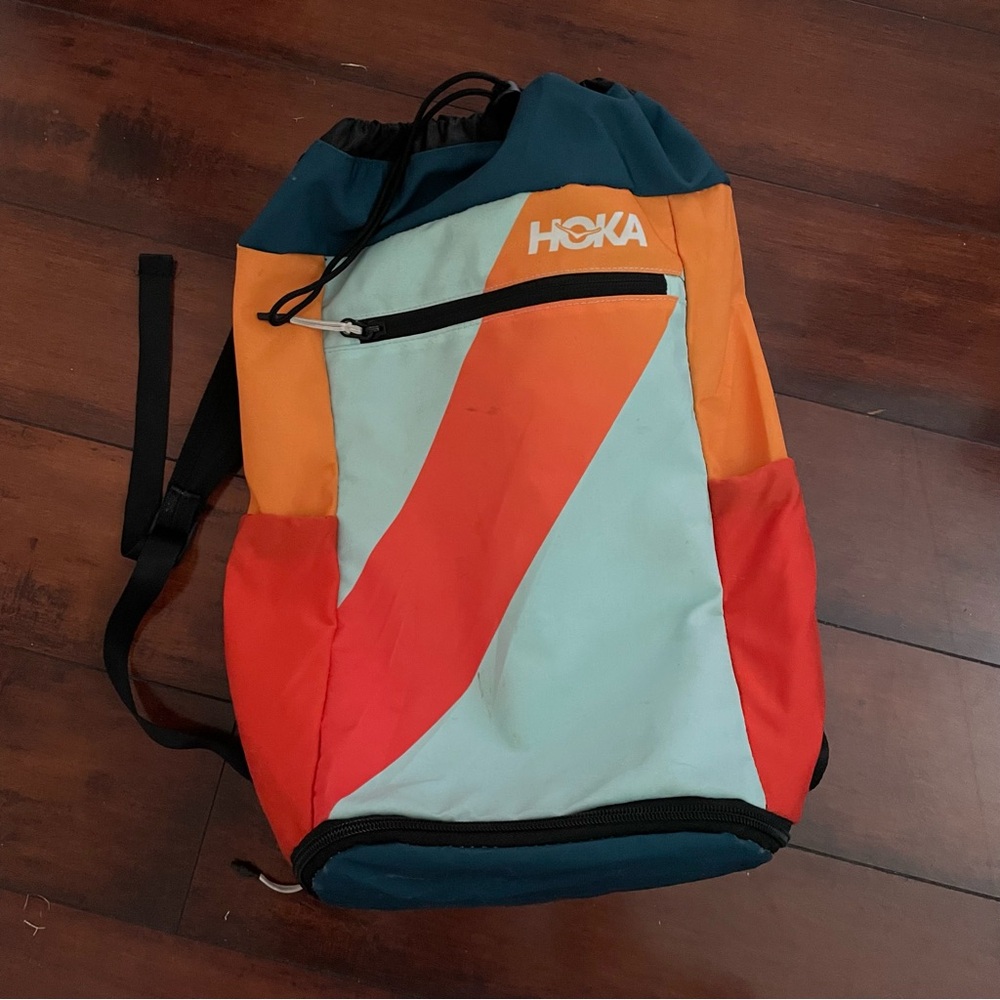 Hoka Vooray Unisex Backpack in Orange, Red, and Teal